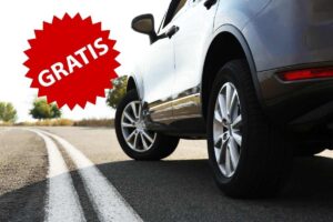 auto di profilo in strada e la scritta gratis